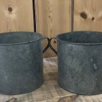 A matching pair of Vintage Galvanised Metal Pots . In Camberley Surrey These containers make fantastic planters and could be used for kindling or as a little bin etc.