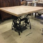 Table from old vintage French cast iron sewing base, with a reclaimed oak top.