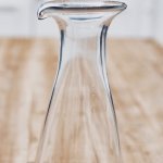 Glass Water Carafe This glass tap water decanter/carafe is an absolute classic. Simple in form with a touch of humour and looks great on any table or in any kitchen.