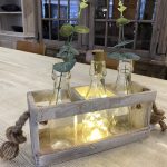 Light and flower stems not included. 27cm W 19cm H 9cm D 9 (H includes bottle) Perfect gift!