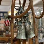 CHRISTMAS BELLS Beautiful very large set of 2 Christmas bells from arkvintage. A pair of large bells on a rope hanger. See pictures for detail. The metal is silver with a green coppery hue.